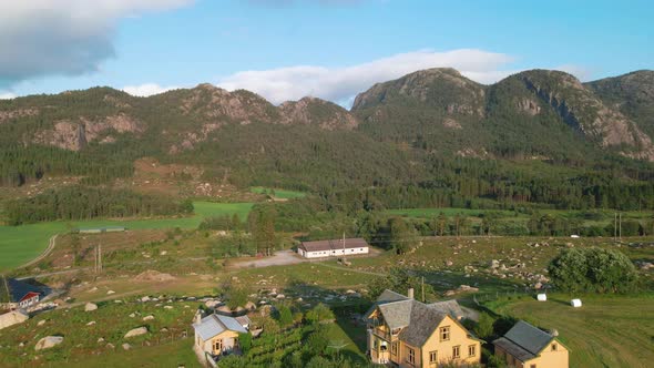 Traditional Norwegian Houses In Countryside In Ryfylke, Rogaland, Norway With Rocky Mountainous Land