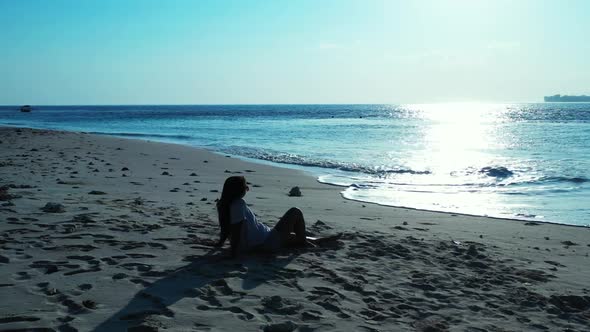 Girls posing on beautiful lagoon beach adventure by turquoise sea with white sandy background of Bal