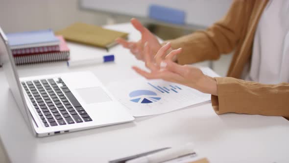 Unrecognizable Businesswoman Gesturing during Online Meeting