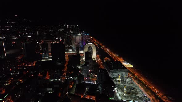 Batumi, Georgia - July 15 2022: Drone flies along new Batumi boulevard at night