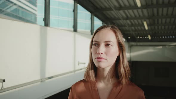 Beautiful Sunlit Woman On Travellator