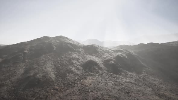 Sun Rays Against the Backdrop of the Mountains alt