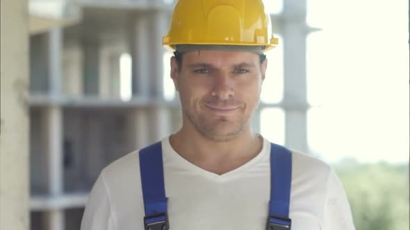 A Handsome Construction Worker Giving a Thumbs-up Sign