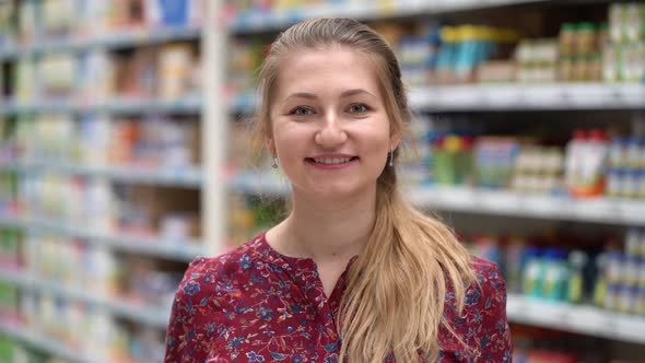 Portrait Attractive Young Woman in Supermarket Marketplace.