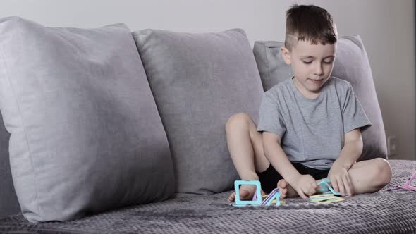 A little boy gaming with magnetic constructor. Creativity development. Magnetic constructor.
