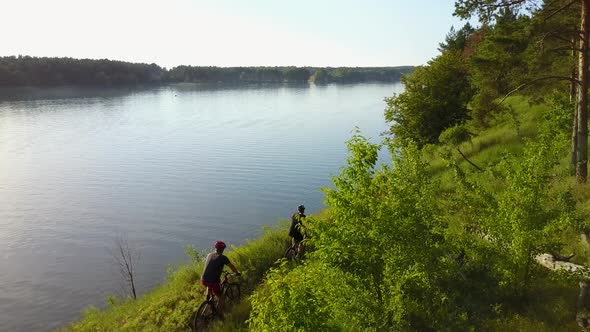 Two Friends Ride Bike