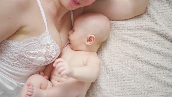 a Mother and the Baby on the Bed