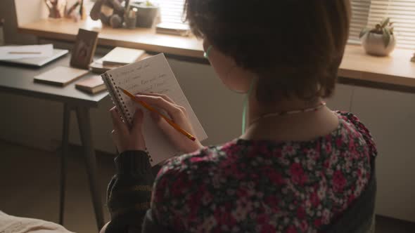 Student Taking Notes in Hospital Room