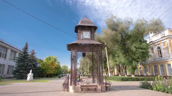 Beautiful Park with Clock on Pavilion in the Center of Uralsk Timelapse Hyperlapse. Western