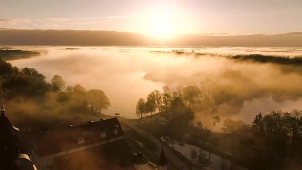 Amazing Dawn in the Foggy Nesvizh, Fog Over the River. Nesvizh. Ancient Castle . Belarus