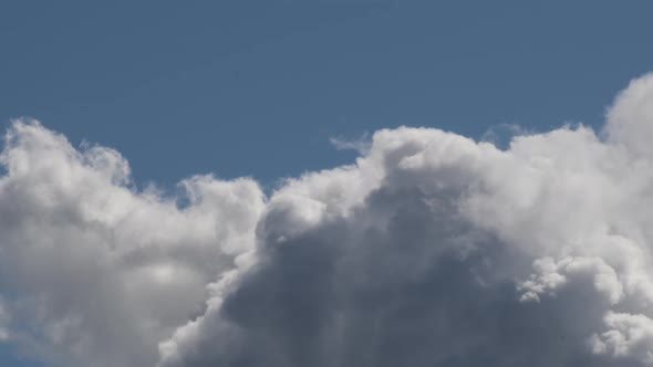 White Clouds Avanzing in the Blue Sky