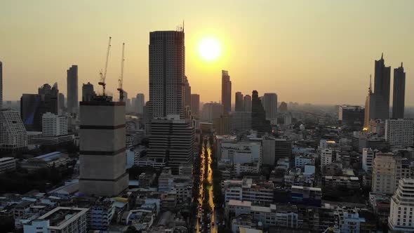 Drone flying towards sunset In Bangkok