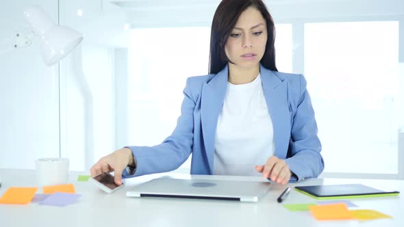 Woman Closing Laptop and Leaving Office