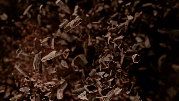 Super Slow Motion Shot of Raw Chocolate Chunks After Being Exploded Towards The Camera at 1000Fps.