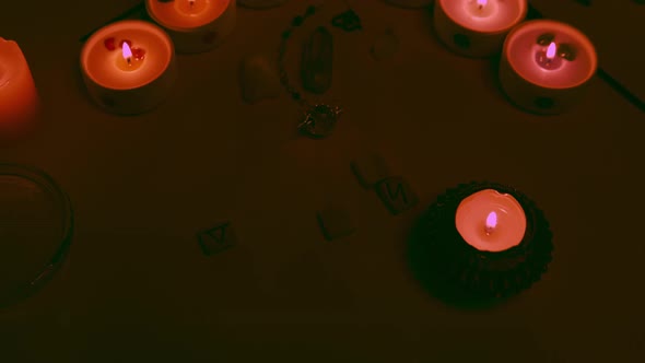 Mystic Esoteric Ceremony with Candles Crystals Runes and Quartz Pendulum