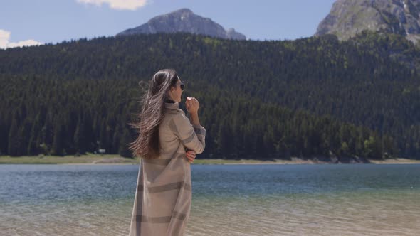 Attractive Woman Relax in Mountains with Lake View on Vacations