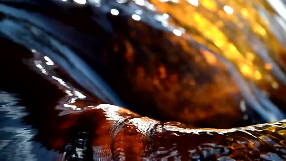 A Swirl of Brownblue Fast Water in a Swift Spring Creek