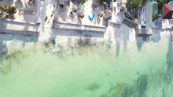 Vertical Video Boats in the Ocean Near the Coast of Zanzibar Tanzania Aerial View