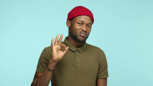 Slow Motion of Handsome Black Man in Red Beanie and Tshirt Smiling and Showing Braces on Teeth