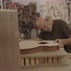 Luthier inspecting a guitar top part - VideoHive Item for Sale