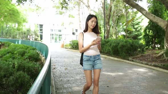 woman use mobile phone in city