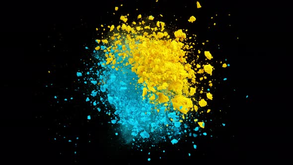 Super Slow Motion Shot of Yellow and Blue Color Powder Expolosion on Black Background at 1000Fps