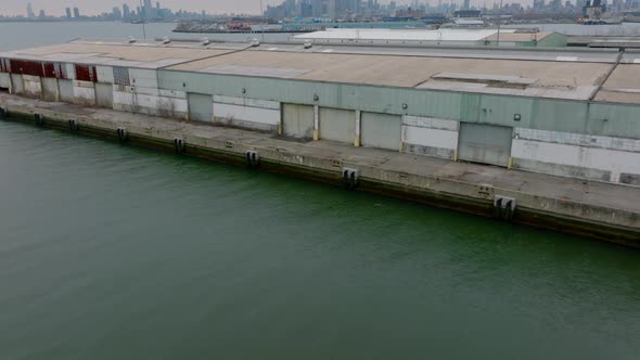 Forwards Fly Over Warehouse Halls on Waterfront in South Brooklyn