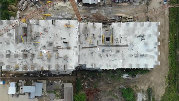 Aerial View of the Construction Site and the Construction Crane From the Top