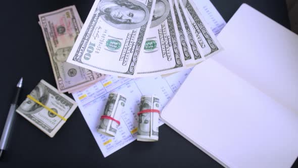 Business Woman Displaying a Spread of Cash US Dollars