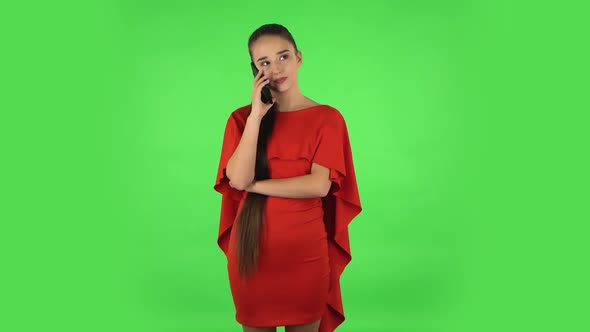 Pretty Young Woman Is Talking for Mobile Phone. Green Screen
