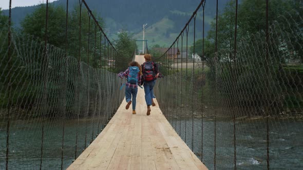 Couple Run Mountains Bridge on Nature River