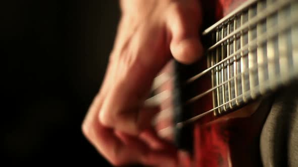 Bass player close up studio shot