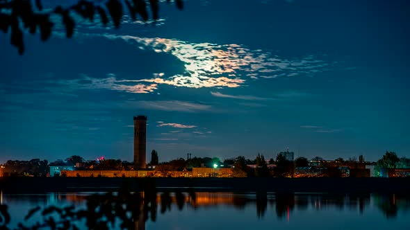Moon over urban lake time lapse video