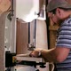 Male Carpenter Working on Milling Machine for Cutting Figure Wooden Detail - VideoHive Item for Sale
