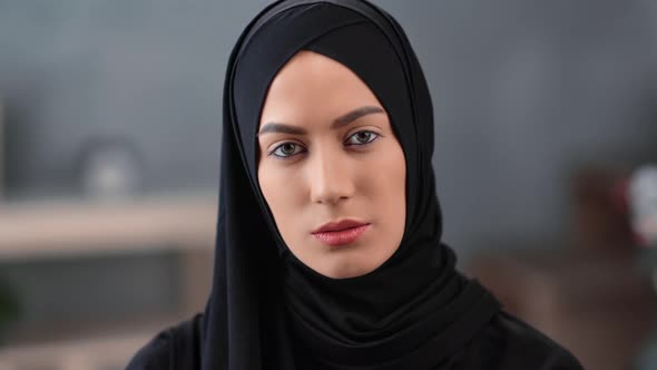 Confident Face of Young Saudi Woman Wearing Black Hijab Headscarf