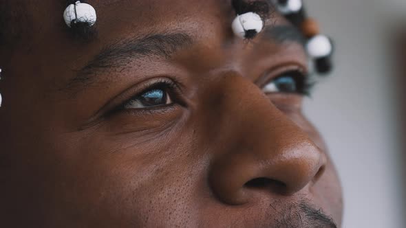 Close Up Peaceful Look in the Eyes of African American Black Man Looking at the Sky