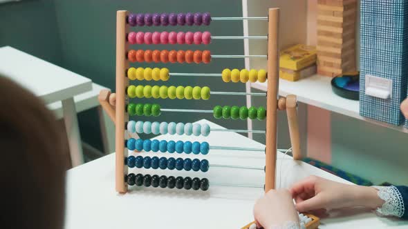 Cute Little Kids Counting with Abacus and Making Gesture of Success Close Up