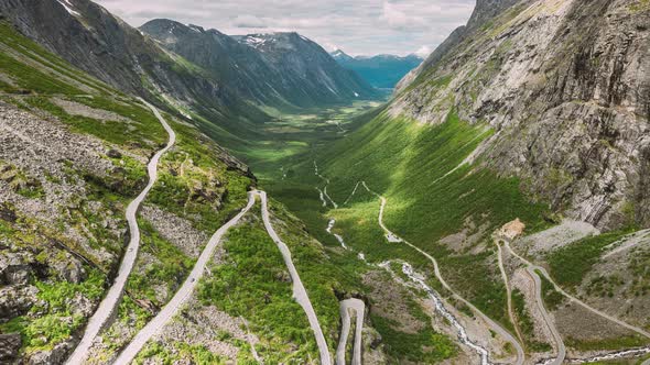 Trollstigen, Andalsnes, Norway. Cars Goes On Serpentine Mountain Road Trollstigen. Famous Norwegian