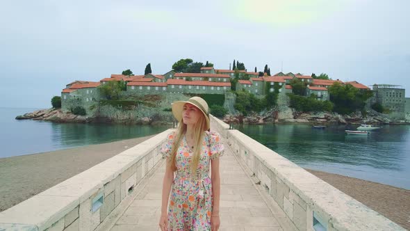 Blonde Woman in Hat Sightseeing and Reflecting on Historical Events Happened There