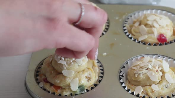 A Woman Prepares A Cruffin With Raisins And Candied Fruits.