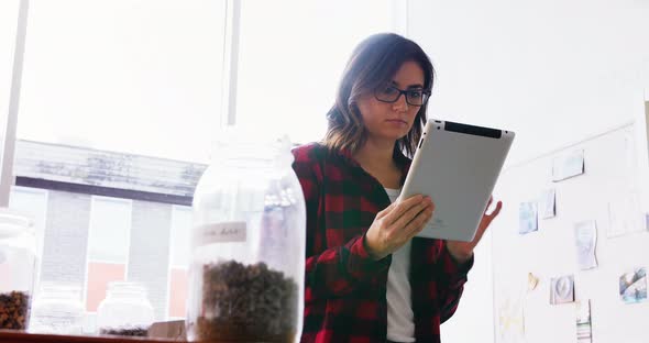 Female executive using digital tablet