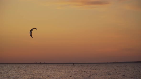 Kite Surfers Ride on the Sea