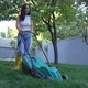 Woman Mowing the Garden Lawn - VideoHive Item for Sale