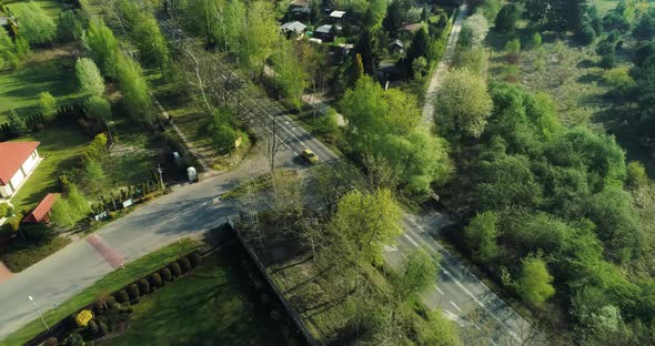 Aerial view of a road going past housing estate.