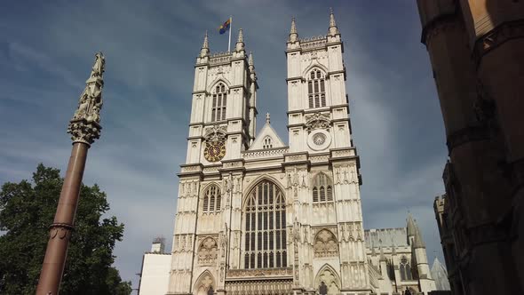 Westminster Abbey facade, showing building detail on sunny day with blue sky, London, UK
