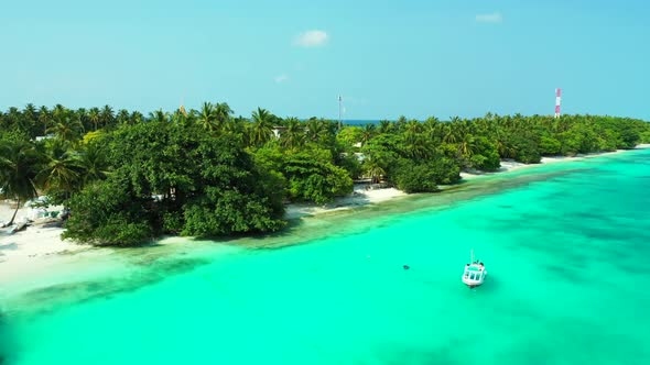 Aerial flying over tourism of idyllic tourist beach time by shallow water with bright sand backgroun