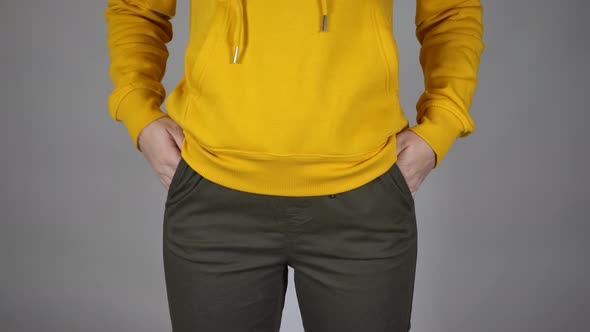 Front View on Body Part of Young Female on Gray Background