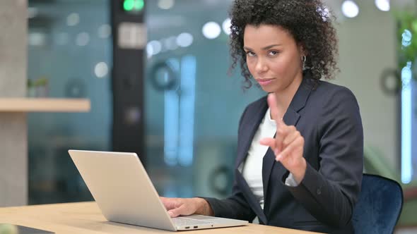 No, Rejecting African Businesswoman Looking at Camera in Office