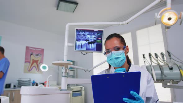 Dentistry Doctor Interrogating Patient and Taking Notes