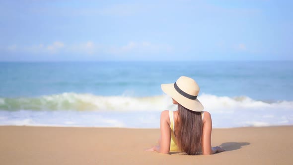 Asian woman enjoy around beautiful beach sea ocean